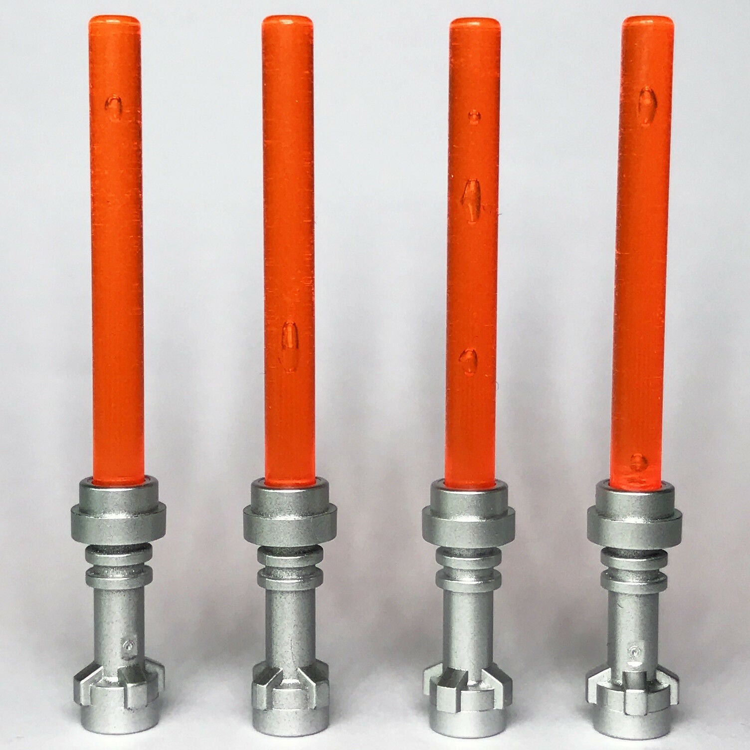 4 x STAR WARS lego TRANSLUCENT ORANGE LIGHTSABERS jedi sith WEAPONS ne